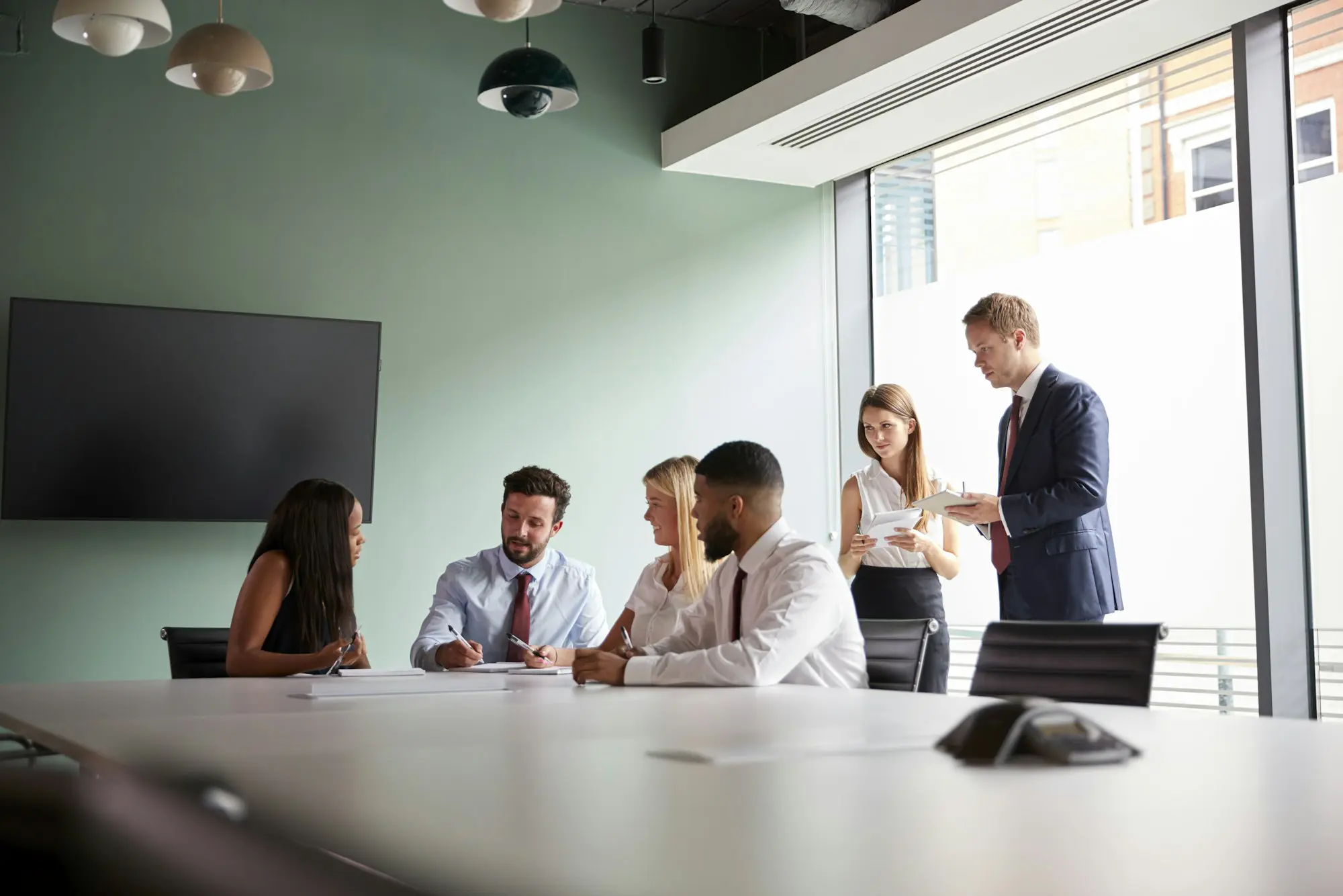 Group Collaborating On Task At Graduate Recruitment Assessment Day